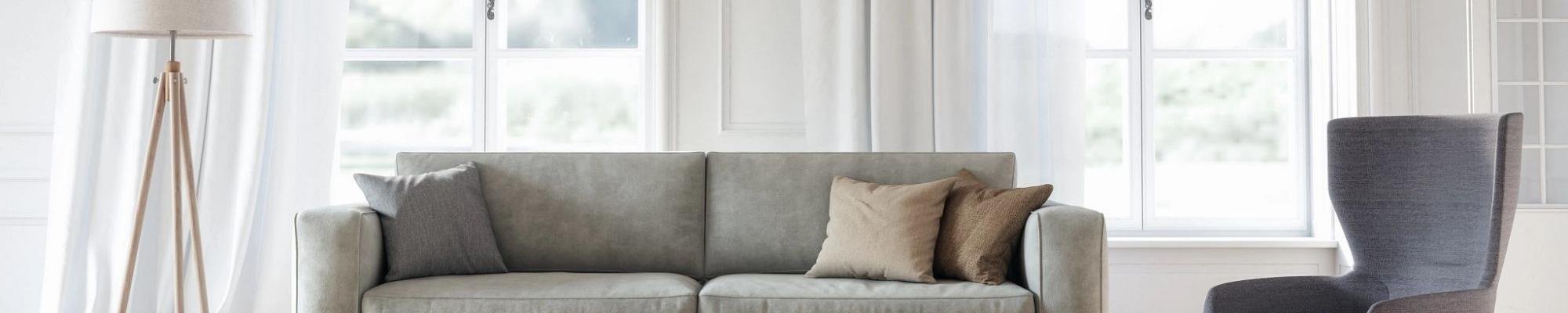 grey couch, seat and lamp in front of window - Shamrock Carpets in PA